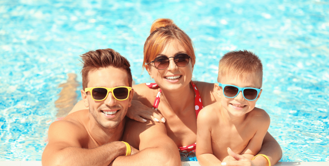 A family practicing pool safety and enjoying the summer.