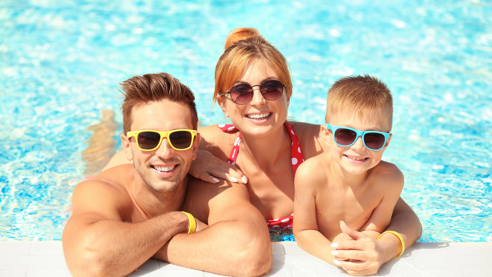 A family practicing pool safety and enjoying the summer.