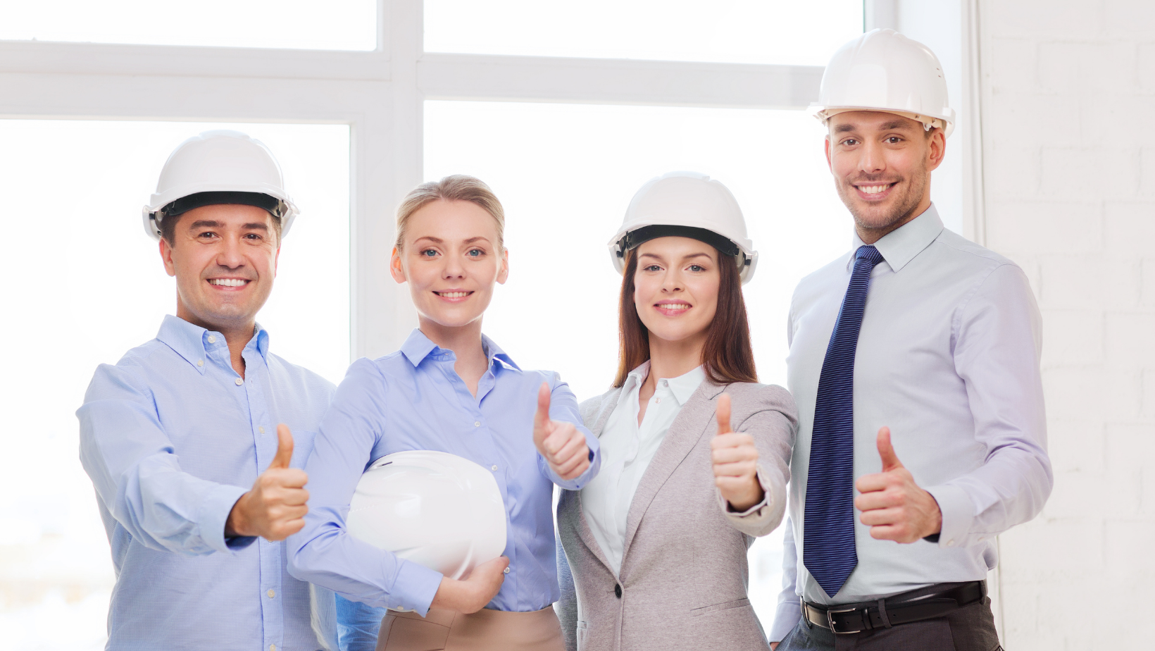 This team of four people give four thumbs up to workplace safety.