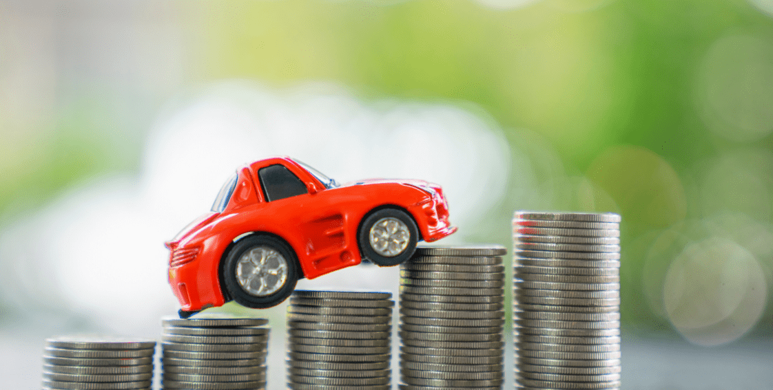 A red car drives on its way to the upcoming $400 vehicle refund