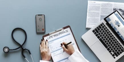 Woman filling out life insurance form