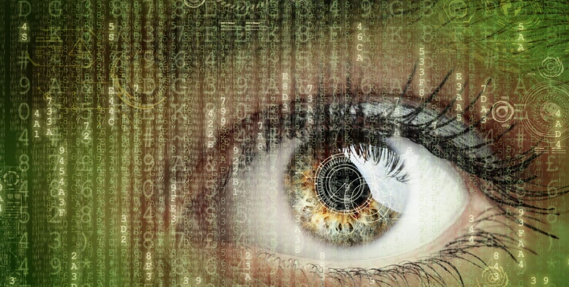 Womans eye with futuristic digital data around it||