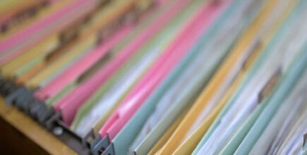 Filing cabinet with folders for record keeping