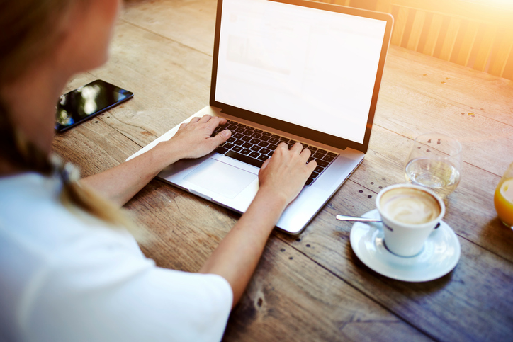 woman on laptop at desk working remotely