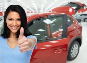 happy client woman near cars. auto dealership and rental concept background.