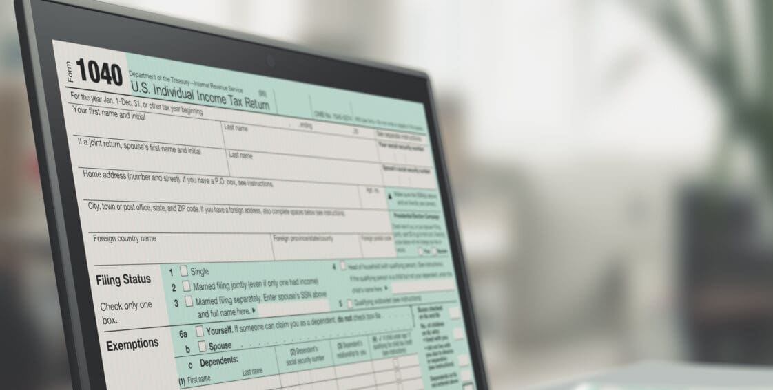 closeup of a computer laptop with a tax form on screen, concept of online tax filing (3d render)