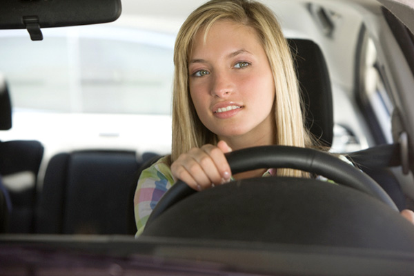 teen driving a car