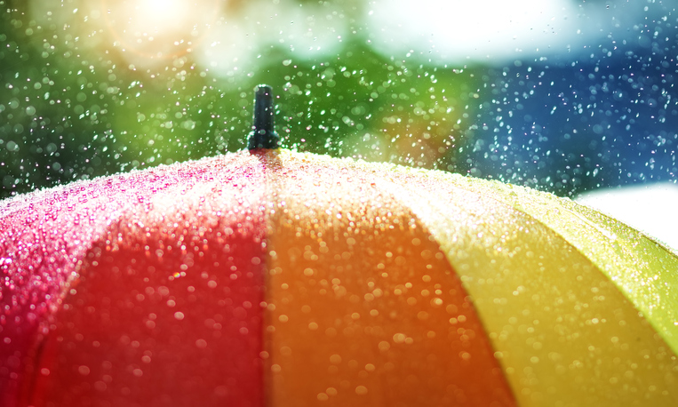 Water droplets falling on an umbrella.