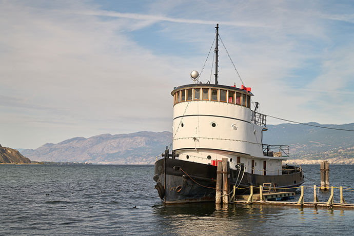 Lake Okanagan Heritage Tugboat. The CN No. 6 tugboat, moored just offshore on Lake Okanagan, is one of the vessels in the Inland Marine Heritage Park.