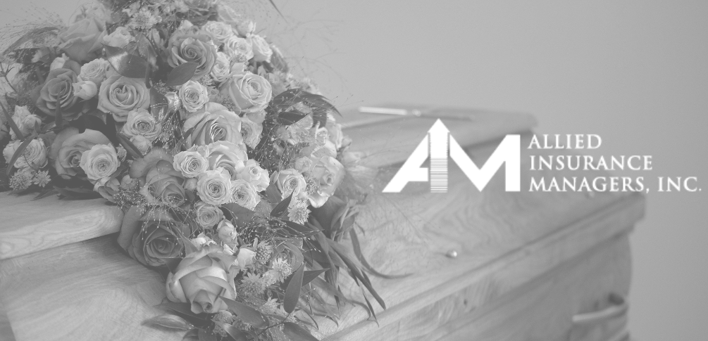 A casket with flowers on it. Allied Insurance Managers' logo is overlayed