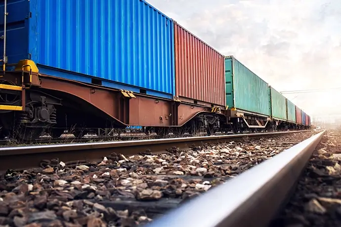 Train wagons carrying cargo containers for shipping companies. Distribution and freight transportation using railroads.